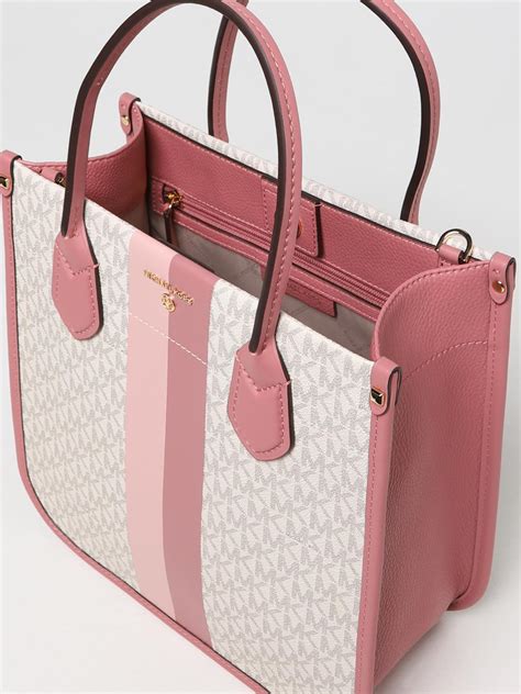 michael kors purses duffle bag|Michael Kors pink suitcase.